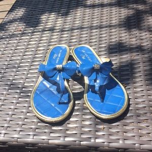 Gold and blue flip flops